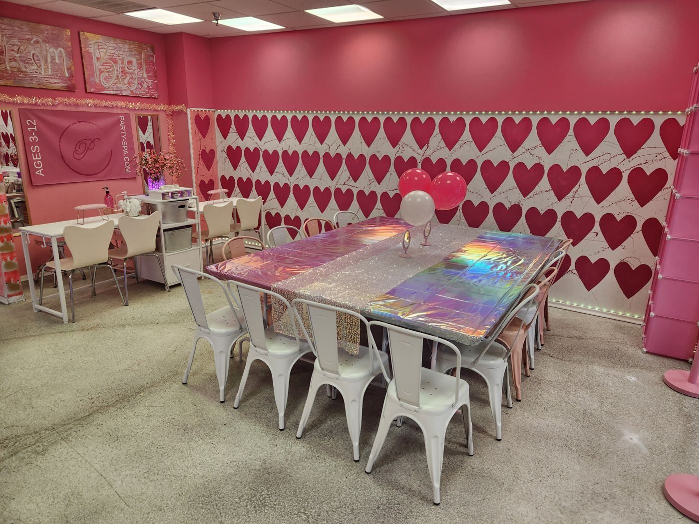 Heart wall party table setup at My Princess Spa Omaha