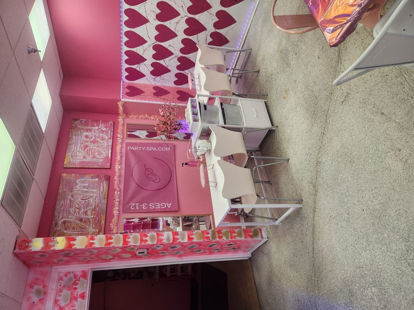 Heart wall mural and party seating at My Princess Spa Omaha