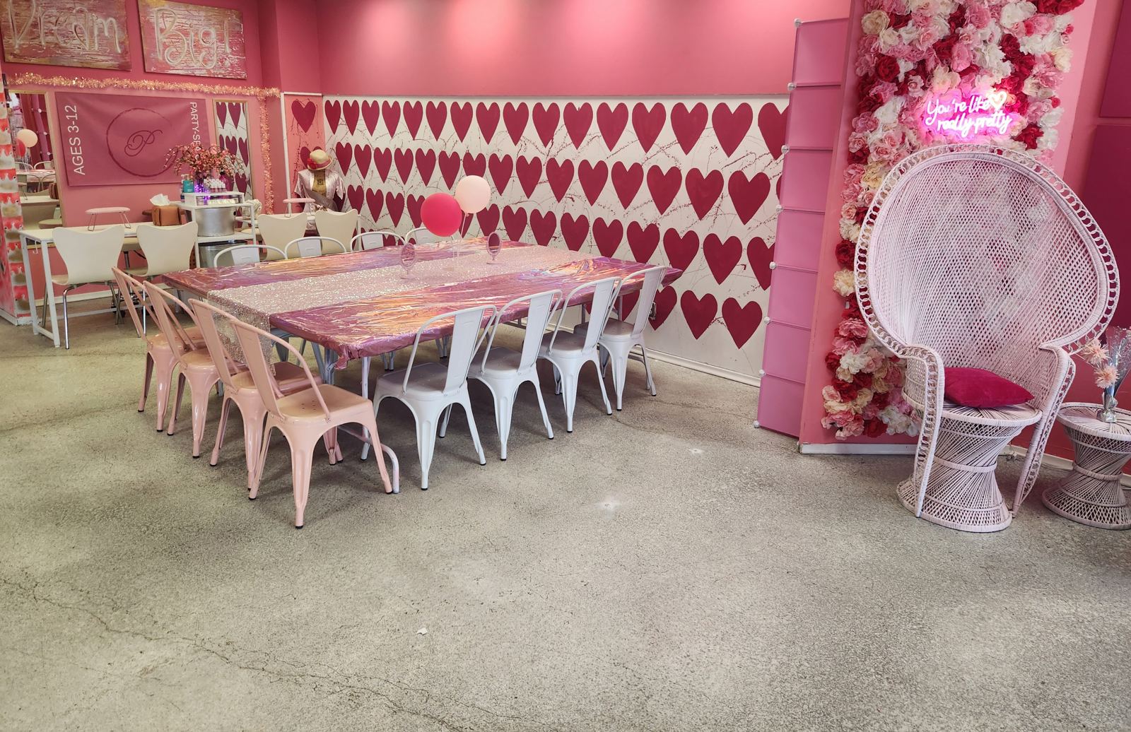 Kids spa party heart wall table setup in Omaha